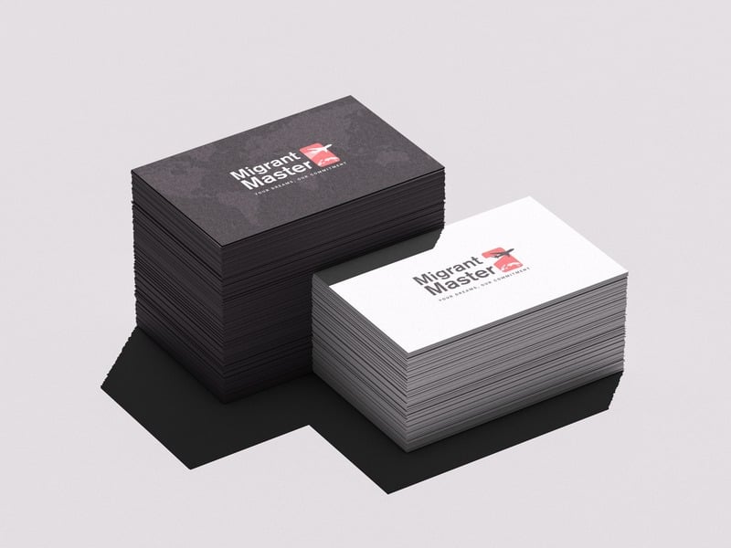 Migrant Master business card stacks — black and white variants